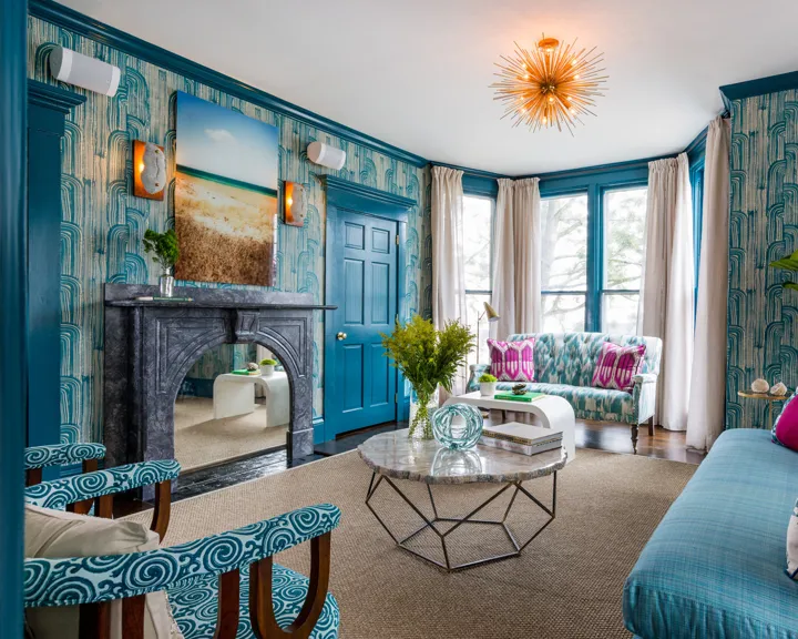 Lounge area with large windows and comfy seating at The Christopher